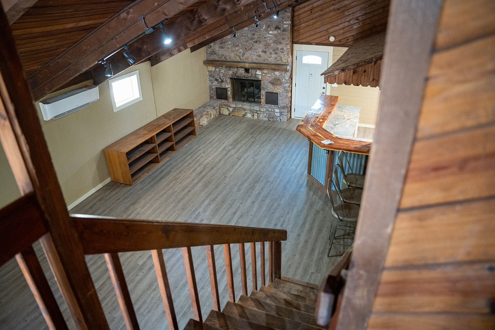 Inside the lodge: stone fireplace and open living space